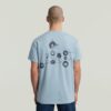 Trims Back Graphic T-Shirt Trims Back Graphic T-Shirt